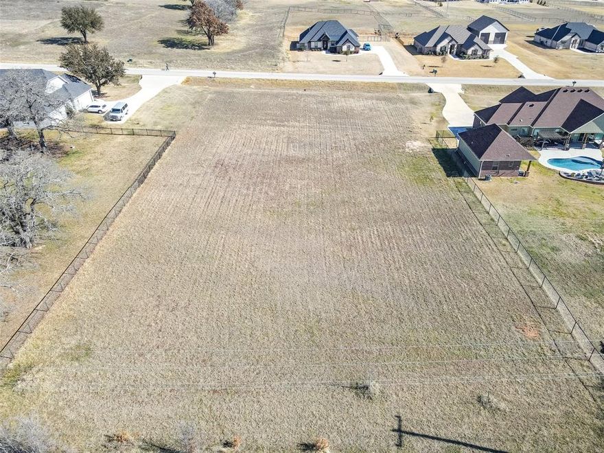 Welcome to 209 Maverick Court, a beautiful cleared and build-ready homesite located in the gated community of Rolling Creek Ranch in Granbury. This property offers an excellent opportunity to design and build your custom home without the added expense and effort of clearing the lot, as much of that work has already been completed. The lot is conveniently positioned near the front of the subdivision on a quiet street that is not a through road, providing easy access in and out of the community while still maintaining a peaceful setting with limited traffic. Rolling Creek Ranch is known for its rolling terrain, mature oak trees and inviting country atmosphere. Neighborhood amenities include a secured gated entrance, two stocked fishing ponds, a community pavilion and park, sports fields, basketball and pickleball courts. Owners may select their own builder, and there is no required time frame to begin construction. A minimum home size of 1,800 square feet helps preserve the quality and character of the community. The property is located just a short drive from Granbury’s historic square with dining, boutique shopping, entertainment and year-round events. Granbury has been recognized multiple times as one of America’s Best Historic Small Towns. Fort Worth is also within convenient commuting distance at approximately forty minutes. If you are looking for a build site that offers an attractive setting, a well-maintained community and a great Granbury location, this lot deserves your consideration.