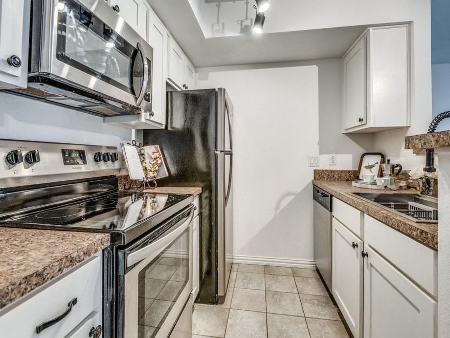 PRICED TO SELL. BRING US AN OFFER. Attractive FIRST-FLOOR condo in a prime Arlington location! This convenient and well-maintained 2-bedroom unit offers easy ground-level access and is just steps from the community pools and mailbox. THREE YEAR OLD ROOF. The kitchen features an updated appliances, flooring and major components have been thoughtfully updated as well, including the water heater and AC unit, both replaced around 3 years ago. Refrigerator, washer, and dryer are included with the sale—making this home truly move-in ready. Situated near some of Arlington’s top attractions—AT&T Stadium, Globe Life Park, Six Flags, and Hurricane Harbor—and only a short drive to DFW Airport, this condo provides outstanding lifestyle and commuter convenience. Inside, you’ll find a spacious layout with updated flooring, updated appliances, and new front windows. Assigned parking space #431 is conveniently located, adding to the ease of daily living. The monthly HOA fee covers full use of facilities, blanket insurance, water, sewer, and trash service—an excellent value in a highly sought-after area. Don’t miss out on this unique opportunity in the heart of Arlington. Call today to schedule your private showing!