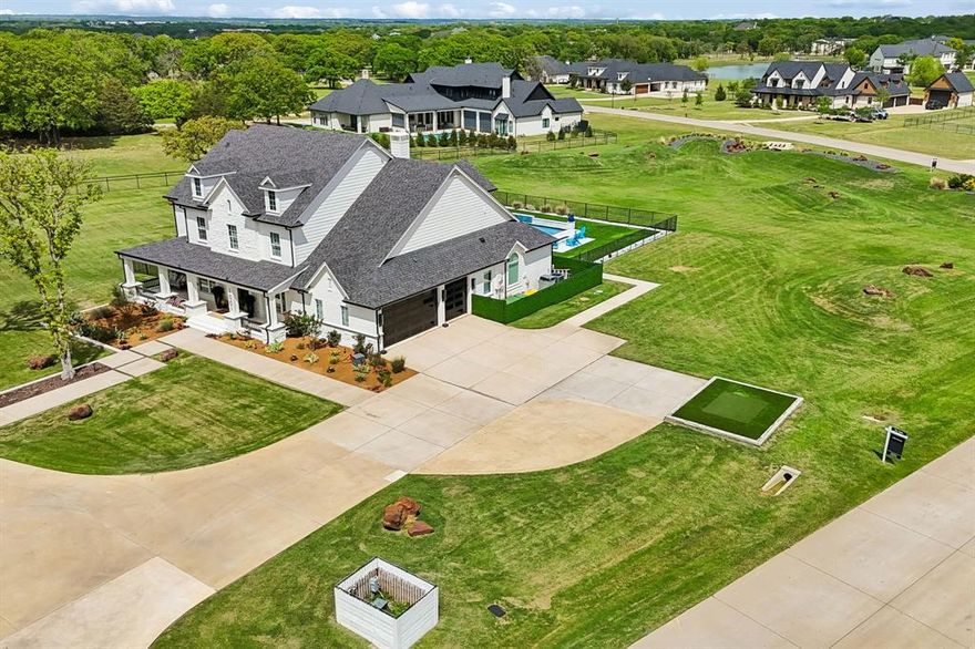 Located in prestigious Hat Creek Estates, this fully renovated Bartonville estate offers a rare blend of privacy, design, and resort-style living on 2.85 beautifully landscaped acres with rolling berms and mature trees. Extensive, high-quality updates throughout deliver a level of finish and functionality rarely found in Argyle ISD.

A welcoming front porch leads to dramatic double iron-and-glass entry doors and an interior where every detail has been intentionally curated. Highlights include a floating staircase, linear gas fireplace, custom designer lighting, and a light-filled open-concept layout ideal for both everyday living and entertaining. The chef’s kitchen anchors the home with premium appliances, including a built-in Miele coffee system and steam oven, along with an expansive walk-in working pantry that balances form and function.

Outdoor living is equally impressive. A custom Claffey heated diving pool and spa are framed by extended patios, lighted decks, built-in heaters, and a firepit, creating a true private retreat. Artificial turf surrounds the pool area and extends to a dedicated dog run. Entertaining is elevated with a built-in Yoder smoker and Evo flat-top grill, complemented by a whole-home audio system that flows seamlessly indoors and out. Lush professional landscaping is sustained by a full-property irrigation system supplied by a private well.

Additional features include a private Par-3 golf hole, 50-amp RV plug, secondary upstairs laundry, and extensive whole-home audio. While the property is part of the Hat Creek Estates HOA, it predates the association and is grandfathered from current architectural and construction restrictions, providing exceptional flexibility for future improvements such as an ADU or guest residence (buyer to verify). Located within Argyle ISD and benefiting from comparatively low tax rates, this move-in-ready estate presents a rare opportunity in one of Bartonville’s most sought-after communities.