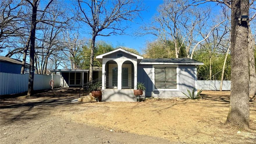 Recently renovated 2.1 home located near Lake Tawakoni. Property features many mature trees, a 20' storage container with electricity, covered parking, and an attached 450sf bonus area that could be upgraded into additional living quarters.