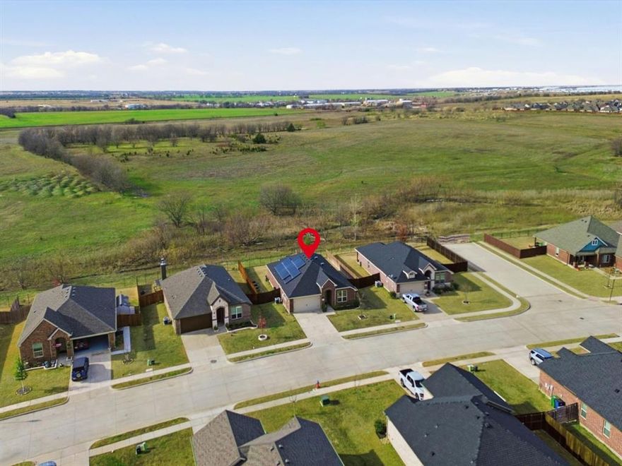 Welcome to this serene, inviting 4 bedroom, 2 bath residence nestled in the heart of Sanger. Thoughtfully designed with both comfort and functionality in mind, this home offers well-utilized living space, perfect for growing families or those who love to entertain. From the moment you step inside, you’ll appreciate the open concept layout and abundant natural light that creates a warm and welcoming atmosphere. The heart of the home is the inviting kitchen space, featuring a grand kitchen island, stainless steel appliances, and a large pantry ideal for weeknight dinners and weekend gatherings alike. The primary suite offers a private retreat with an en-suite bath complete with a separate shower, and garden tub, while the additional 3 bedrooms provide flexibility for kids’ rooms, an in home office, or guest space. Once outside enjoy the covered patio within the private backyard, sitting up against a greenbelt, perfect for BBQs, pets, and those much needed relaxing evenings. Located in the Sanger Circle neighborhood, residents enjoy the greenbelt, parks, and playgrounds, with convenient access to all things. This home is the perfect blend of comfort, charm, and convenience and ready to welcome its next chapter. Solar panels will be paid off at closing.