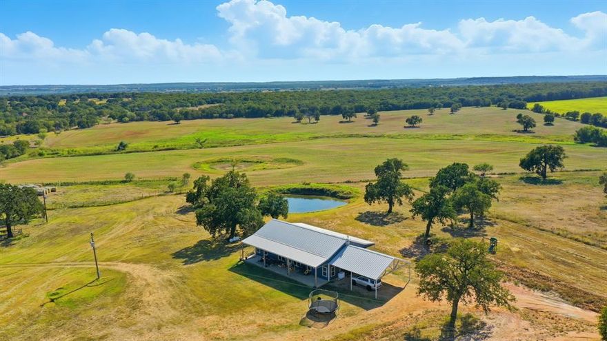 BEAUTIFUL CUSTOM BUILT 2400 Sq Ft BARNDOMINIUM on 12 ACRES of SANDY LOAM SOIL covered in COASTAL BERMUDA and NATIVE GRASS with a STOCK TANK, BARN, PENS and PLENTY OF ROOM FOR ARENA, STALL BARN, SHOP, etc!!!  Located on a Quiet and Secluded County Road in Palo Pinto County less than 5 minutes from Lipan and Hwy-281 and only 10 minutes for IH-20 this Hidden Gem is situated in Lipan ISD and offers a Full RV Hookup, Co-op Water, Co-op Electricity and High Speed Internet.  With NO Pipelines, Power Lines, Floodplains or Restrictions this Ag Exempt canvas is READY for YOUR VISION!!!