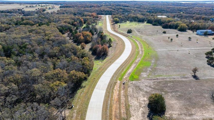 IF PEACEFULNESS, SERENITY, BEAUTY, MAGNIFICANT PANORAMIC VIEWS, SANCTUARY, BEAUTIFUL CENTURY OLD OAK & PECAN TREES, AN ESCAPE FROM BIG CITY WITH NO COMPROMISE IN MODERN AMENITIES & COMFORTS, YOUR HORSES, NO HOA, LOW TAXES, AND NO CITY TAXES, NO MUD, ALL UTILITIES AVAILABLE IS WHAT YOU'RE SEEKING THEN LOOK NO FURTHER! Nestled in Prime Location Just Minutes from Ray Roberts Lake & I35, Offering Perfect Blend of Rural Serenity & with easy Commute to Denton, DFW, DFW I'national Airport, Small Town Charm of Neighboring Towns with Quaint Boutiques & Antique Shops, Wonderful Restaurants, Edge of the Lake Vinyard, Winstar Casino, and Local Breweries. ITS A WONDERFUL LIFESTYLE, AND AN OPPORTUNITY TO BUILD YOUR DREAM HOME AND MAKE LASTING MEMORIES! SELLER WILL GIVE 1ST 2 LOT BUYERS $10,000 BONUS & $5,000 CLEARING FEE IF BUYERS BEGIN BUILDING WITHIN 1ST 3 MOS. MONEY REMAINS IN ESCROW UNTIL CONCRETE SLAB POURED & FRAMING BEGINS. This is a Rare Opportunity to Own Small Acreage Around Ray Roberts Lake & Build the Home of Your Dreams! Come See all the Beautiful Area has to offer!