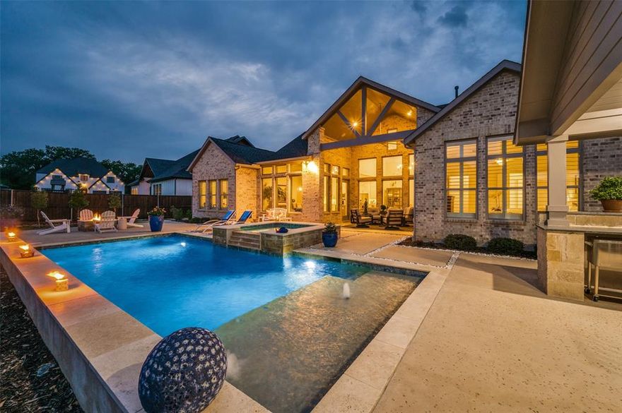 Welcome to this stunning, modern one story home located in sought-after 5T Ranch located minutes to Denton Country Club, top rated Argyle schools & major roads. This ideal floor plan offers an impressive extended foyer that leads to the light filled living room where a wall of windows showcases the backyard oasis. The living area flows into the bright kitchen that boasts quartz countertops, a large island, double ovens & a gas cooktop. The generous dining area can accommodate a large table for your gatherings.  Enjoy your favorite movies or sporting events in the cozy media room equipped with surround sound wiring & speakers. There is a private study located off the foyer with views to the front yard. The three way split bedrooms each feature a full bath offering privacy & the opportunity for multigenerational living. The serene primary suite offers views to the pool and features a spa-like bath with a huge walk-in shower, large soaking tub, his & hers vanities and a generous walk-in closet.  Just in time for summer fun, retreat to the resort style backyard where you will enjoy an extended covered patio, a sparkling pool with spa, & a cabana with a built in grill, flat screen TV wiring, a bar & leather granite countertops. Chilly outside?  Sit around the firepit & enjoy sharing stories with friends or just a quiet relaxing evening. This home is perfect for indoor & outdoor year round entertaining. Improvements include exquisite lighting fixtures, whole house surge protection, recent HVAC,  & plantation shutters  Almost one third acre of meticulously designed extensive landscaping that includes river rock beds, concrete paver walkways, and an abundance of thoughtfully positioned shrubs & trees. The family friendly neighborhood features a playground, a trail system that leads to Hilltop elementary & fun get togethers with your neighbors.