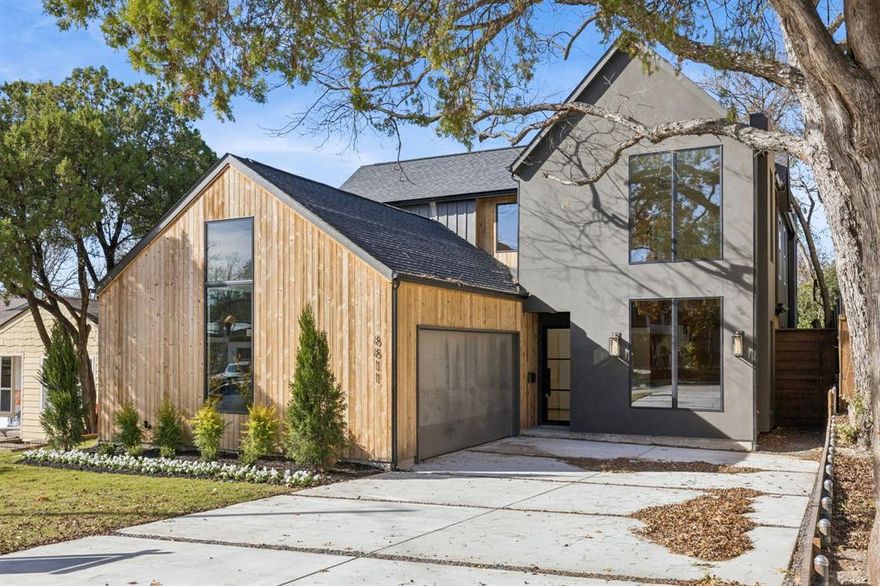 Built by BuildTX Solutions in close proximity to White Rock Lake, this home features 4 bedroom, 4.1 bath home with almost 4,000 square feet offers the perfect blend of elevated style and everyday comfort. Upon entering, a double story foyer with curved staircase greets you in addition to the chevron white oak flooring. The main level features a dedicated home office, a chef's kitchen outfitted with premium appliances, a butler’s pantry, and an open dining room with coffered ceilings and large windows that bathe the space in light. Tucked away on the main level, the primary suite is a private escape with backyard access and a spa-inspired bath with dual vanities, and a deep soaking tub with a separate shower. The large walk-in closet leads to direct access to the laundry room. Upstairs, three secondary bedrooms, one of which has its own outdoor patio, complete the highly functional layout.