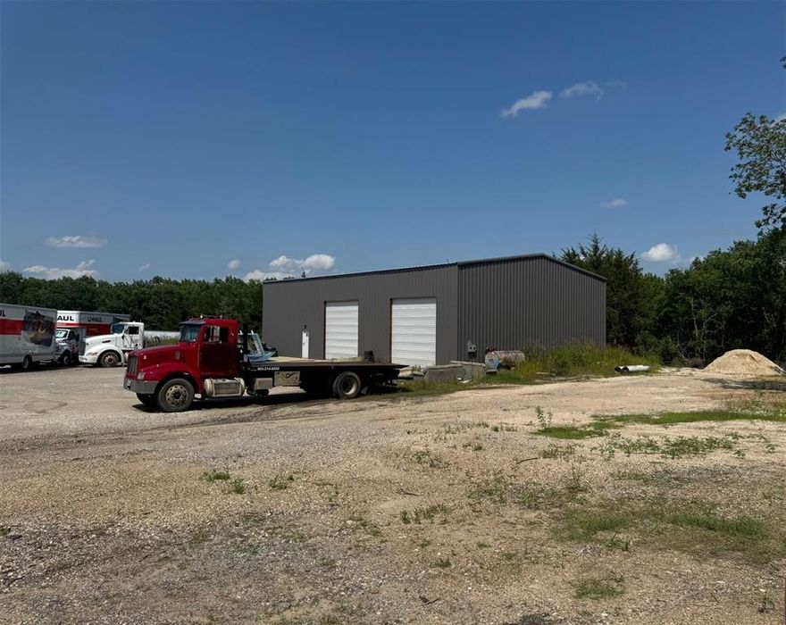 Great location for business catering to truck or automotive repair, service.  Property previously used as a Truck depot for Sand and Gravel Hauling business.  Zoned commercial.  New entry will need to be made from Hwy. 56.  Wired. For electricity, but needs a meter and to be connected at pole.  Close to Hwy 82 and 75.  Huge 3750 tall 75' X 50' building has unlimited uses.  Any proposed new business will need prior approval from Sherman P&Z.  Great opportunity for auto or truck service, or any other creative ideas that can utilize 7.56 acres and the building.  Approximately 1 acre is in a flood plain but does not regularly flood.  Ask for a showing on this unique location close to everything happening in Sherman!