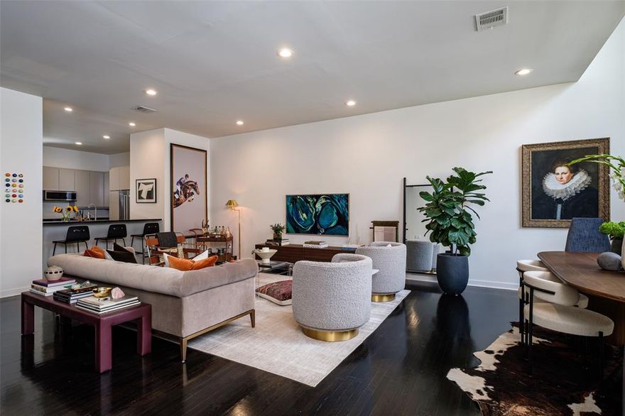 Steps from the Katy Trail, around the corner from Knox, and minutes to West Village, this 2,350 sq. ft. townhome offers both walkability and privacy in one of the community’s quietest locations. The first level includes a gated front patio, a private guest suite with ensuite bath and office nook, a dedicated laundry room, and a two-car garage. On the second floor, the kitchen has been fully updated with brand-new appliances (2025), granite counters, and modern lighting. It opens to a spacious living and dining area with dark hardwood floors and freshly painted interiors. A wall of windows brings in natural light, and the oversized deck (2025) extends the living space outdoors. The third floor is dedicated to the primary suite, designed with a reading nook, walk-through closet, and ensuite bath featuring dual sinks, a soaking tub, and separate shower. Just beyond, a versatile loft offers flex space for a study or studio. Throughout the home, refinished hardwoods, designer wallpaper in each bath, updated window coverings, a sisal stair runner, Nest thermostats, and newly cleaned windows add to the polished finish. The community is well-built and low-dues, set along tree-lined streets. Nearby favorites include Rose Café, Beverly’s, and Georgie’s Butcher Shop.