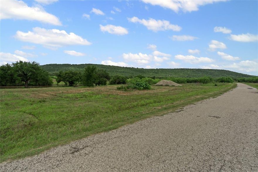Owner financing available!! Take a look at this beautiful piece of heaven right here in Palo Pinto. The property has 6.19 acres and boasts a large pond, as well as being a stones throw from Palo Pinto Lake. Due to the amazing location, this land would be a perfect place to build your dream home, a weekend getaway, or a thriving business. In addition, a water producing well has already been installed. Let your imagination go wild and make this 6 acre property your own.