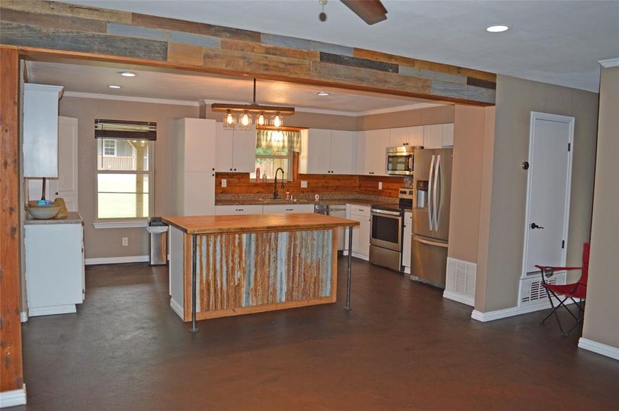 Very well-maintained home Southwestern style new landscaping, very energy efficient double pane windows that can be opened from the bottom or top window , Stainless steel appliances, Very Nice Whirlpool Stainless Steel refrigerator side by side doors with ice and water dispenser and bottom door freezer stays with the home. Great tall privacy fence with electronic gate that can be opened by remote or keypad.
New air-conditioning unit installed within the last two years, very nice 25x24 metal building with spray foam insulation recently built with multiple electric outlets, air lines installed with multiple air outlets in the shop and one on the outside front also a 20X24 covered carport attached to shop 10x24 lean-to on east side.
Very nice 12x24 outbuilding shed completely remodeled inside new floors, paneling full insulated with mini-split heating and air conditioning to keep you cool in the Summer and very warm in the Winer, two upper lofts, electric and lights also plumed for water to sink and toilet.
Stone fire pit next the shop.
All of this for comfort and very close Lake Grandbury boat ramps and the Brazos River.