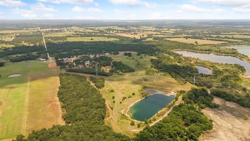 Incredible property with 27+or- acres with a 3-acre +or- lake for fishing. Plenty of room for hunting as well. Electricity at the road.  A well will be required as well as septic. The majority of the property is located in a flood plain. Refer to the FEMA flood maps.  The front of the property, toward the road, is not in the flood plain.  No restrictions. There is an RV that can be included with an acceptable offer.  New survey will be required at Buyer's expense.