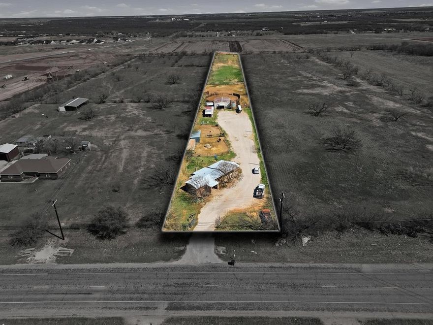 Looking for the perfect setup for your horses just outside Abilene? This 2.870 acre property is a rare find, packed with functionality and Western character. The home itself is small but full of charm, featuring unique original stonework that gives it a one of kind feel. The real star of the property is the fully equipped horse facility, thoughtfully designed for trainers and serious horse enthusiasts. You’ll find a large barn with four stalls, each with runs, plus a separate stud stall with tall pipe fencing for added security. The barn also offers three tack rooms that can double as hay storage, giving you plenty of flexibility for your operation. Attached to the barn is a round pen, along with a separate square pen. Ideal for training, working, or exercising horses. The entire property is fenced, with the back portion already planted and ready for grazing. Additional features include a silo that was previously used for grain storage, two bunkhouses ready to be restored or repurposed, and a sea container that will convey for hay storage. Please note that horse equipment and panels do not convey with the property. Whether you’re looking to train, board, or simply enjoy your own private horse property, this one is ready to go with room to make it your own.