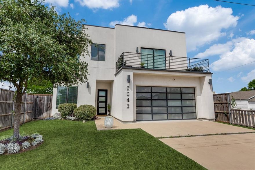 Location. Luxury. Lifestyle.

Welcome to an exceptional modern residence offering the perfect blend of sophistication, space, and urban convenience—just minutes from Downtown Dallas, Bishop Arts, Trinity Groves, Victory Park, and Uptown. With seamless access to major highways, including I-35, 75, 30, and 45, every destination is within easy reach.

Spanning approximately 3,600 square feet, this architecturally striking home is designed for elevated living, featuring 10-foot ceilings, 4 bedrooms, 4 full baths, and 3 expansive living areas. Two private balconies and a stunning rooftop terrace showcase breathtaking panoramic views of the Dallas skyline, creating the ultimate setting for relaxation or entertaining.

At the heart of the home, the chef’s kitchen is a true statement piece, highlighted by a dramatic waterfall porcelain island with a gas cooktop, flowing effortlessly into the dining and living spaces. A sleek marble-faced fireplace anchors the main living area, delivering both warmth and contemporary elegance.

A grand 22-foot gallery-style entry hallway sets the tone upon arrival—an ideal backdrop for showcasing fine art and creating an unforgettable first impression.

Designed with both luxury and flexibility in mind, the home features two exquisite primary suites, each with a spa-inspired bath complete with a soaking tub, glass-enclosed shower, dual vanities, and expansive his-and-her closets.

Additional premium features include a 2-car garage with epoxy flooring, a tankless water heater, and a Tesla charger. The private backyard provides a serene canvas for your custom outdoor retreat.

Why compromise with a long suburban commute when you can enjoy refined living, generous space, and the vibrant energy of Dallas at your doorstep?

Schedule your private tour today. This extraordinary residence will not last long.