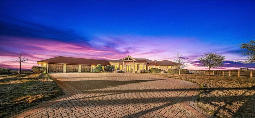 Recognized as one of the premier Central Texas properties, Stampede Ridge offers a host of recent, no cost spared improvements which transformed an already desirable, ultra-distinctive property into the area’s crown jewel for discerning, equestrian focused buyers seeking luxurious accommodations, breath taking views, thoughtfully planned and executed equestrian amenities, and exceptional access to Waco, Temple, Austin, and even Dallas.    From the magnificent panoramic views to the property’s gentle rolling hills, inside and out, this estate property impresses at each turn, never leaving potential buyers hoping for more.

Constructed in 2008, the truly inspired, 4,715 square foot home boasts three bedrooms, three, en suite bathrooms, two living rooms, a central office, formal dining room, breakfast room, eat-in kitchen, convenient pool bath, and oversized mud room which doubles as a second office.  Perched high atop a hill, the home enjoys panoramic, thirty-mile views from all rooms and especially spectacular sunsets from the backyard covered patio and outdoor kitchen. Throughout the building process, every selection in this home was scrutinized, planned, and carefully procured so that the home's construction fully realized the vision of the owners.  From the Colorado sourced metal roof to the exquisite natural stone floors, reclaimed tin, recent décor and technology upgrades, and elimination of soft surface flooring, the home needs absolutely nothing and is perfectly positioned for immediate move in.
   
Outside, within the wooden dwelling fence, the resort like pool, spa, and wrap around patio yield the aforementioned, stellar sunset views.  Garage parking at the main home accommodates three large vehicles while still providing ample storage and the massive motor court easily accommodates another dozen or so vehicles.  Beyond the home’s second, private gate, a 2,280 square foot barn, complete with hay loft, office, and plumbing allows for additional covered pa