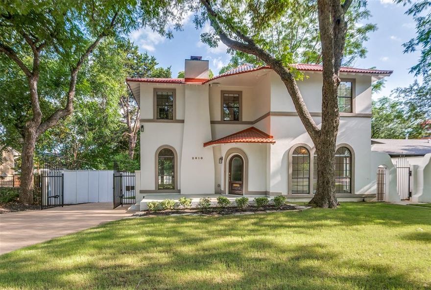 Stunningly updated 1930's Spanish Colonial home in coveted Stevens Park Estates with very rare 4-bedroom, 4-bathroom floorplan. Beautiful formal Living Room with coved gas fireplace, arched windows and doorways, and French doors to the backyard. Oversized downstairs Bedroom with 5 arched windows would also serve as a bright and secluded Home Office, with a gorgeous nearby full bathroom. Gourmet Kitchen features stainless appliances, convection double oven with microwave, and 5-burner gas cooktop. Great Laundry Room with built-ins. 2-story Family Room with huge windows and Bar overlooks the incredible backyard accessible through French doors. Upstairs Primary Suite with fireplace and vaulted ceilings, designer Primary Bath with soaking tub and double walk-in shower, plus boutique-style walk-in closet. 2 secondary upstairs bedrooms each feature their own bathroom and great closets. Enormous backyard. New roof. Zoned for highly-desirable Rosemont schools. Easy access to both airports, Stevens Park Golf Course, Bishop Arts District, & Downtown Dallas.