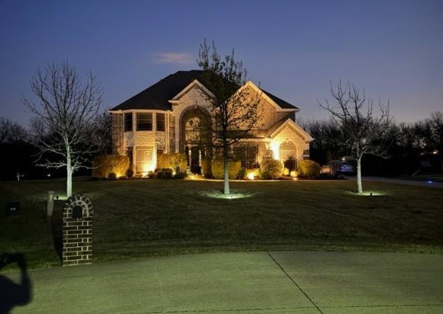 Nestled on a full 1-acre lot within a private gated community in Cross Roads, this stunning custom home offers the perfect blend of space, functionality, and upscale living. Featuring approximately 4,327 square feet, this impressive residence includes 6 bedrooms, 3.5 bathrooms, and a thoughtfully designed layout ideal for both everyday living and entertaining. Step inside to find rich hardwood flooring, designer finishes, and multiple versatile living spaces including a dedicated office, media room, game room, and reading area—providing flexibility for work, relaxation, and hosting guests. The spacious kitchen is equipped with granite countertops, double ovens, and ample storage, seamlessly connecting to the main living areas for an open, inviting feel. This home is uniquely designed with two primary suites, offering ideal accommodations for multi-generational living or long-term guests. Upstairs and downstairs living spaces provide privacy and comfort for all.

Enjoy outdoor living at its finest with an expansive east-facing covered porch, perfect for entertaining or relaxing while overlooking the large backyard enclosed by a wrought iron fence. The generous lot provides plenty of room for a pool, play space, or future customization. Additional highlights include a 3-car garage, energy-efficient features, and a brand-new roof scheduled for completion in April 2026, offering added peace of mind for future homeowners. Located in the desirable Villages at Cross Roads, this home offers the tranquility of country-style living with convenient access to nearby shopping, dining, and major highways.