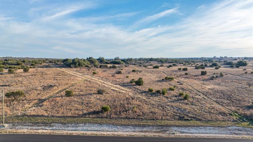 Discover the perfect canvas for your dream home at The Ranches at Star Hollow! This stunning 3.1-acre lot offers a mostly flat terrain, ideal for building and embracing a peaceful rural lifestyle. Enjoy modern conveniences like paved roads, high-speed fiber-optic internet, and private wells for water. Conveniently located just a short drive from Granbury and only an hour from Fort Worth, you'll have easy access to shopping, dining, and entertainment while savoring the serenity of country living. Don’t miss this incredible opportunity!

Note: This listing is for vacant land only. Year Built is a placeholder due to system requirements.