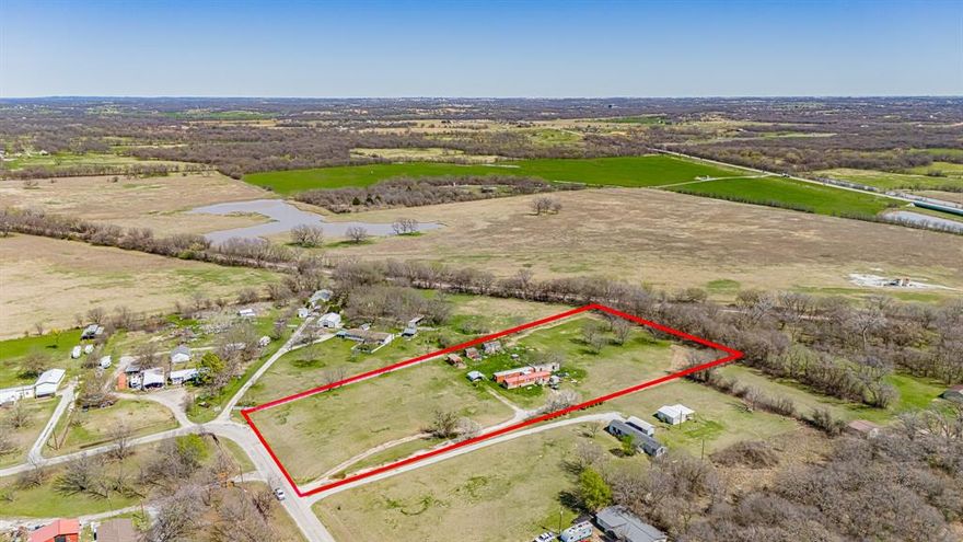 Welcome to Paradise, Texas where the name truly reflects the setting. This scenic 5-acre, tree-covered property offers a unique opportunity for both investors and future homeowners. The land is lush and green year-round and features two well-maintained mobile homes, both currently producing income.

The first home offers 3 bedrooms and 1 bathroom, while the second features 2 bedrooms and 1 bathroom. Both homes have new roofs and are separately metered for electricity, which is paid by the tenants. City water services the property, with usage handled between the tenants, and there are two separate septic systems in place.

With no zoning restrictions, this property offers flexibility—continue operating as a rental investment, build a new home, or explore other permitted uses. A county restriction allows one home per 2.5 acres, providing additional development potential.

The property currently generates $1,660 in gross monthly rental income, with both tenants on month-to-month leases, offering flexibility for a new owner.

Owner financing is available with a substantial down payment at 5% interest for 20 years, making this an attractive opportunity to own acreage in a desirable rural setting.