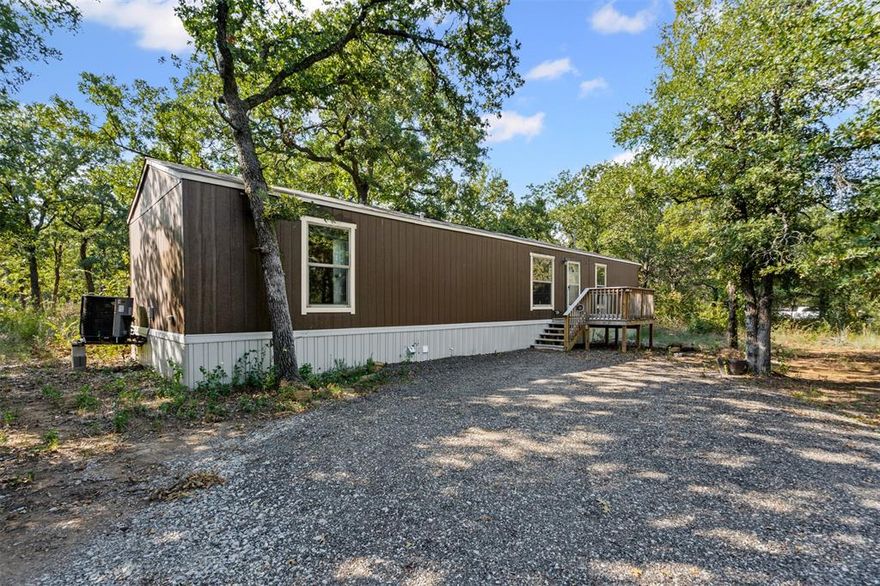 Very nice manufactured house in Bridgeport TX. Built in 2023 like new home, very nice property with tons of trees and privacy minutes to Lake Bridgeport. The area is quite secluded with lots of trees at just under a .25 acre tons of space to relax, entertain or just take in nature around you. 
City water and sewer services provided by Runaway Bay.