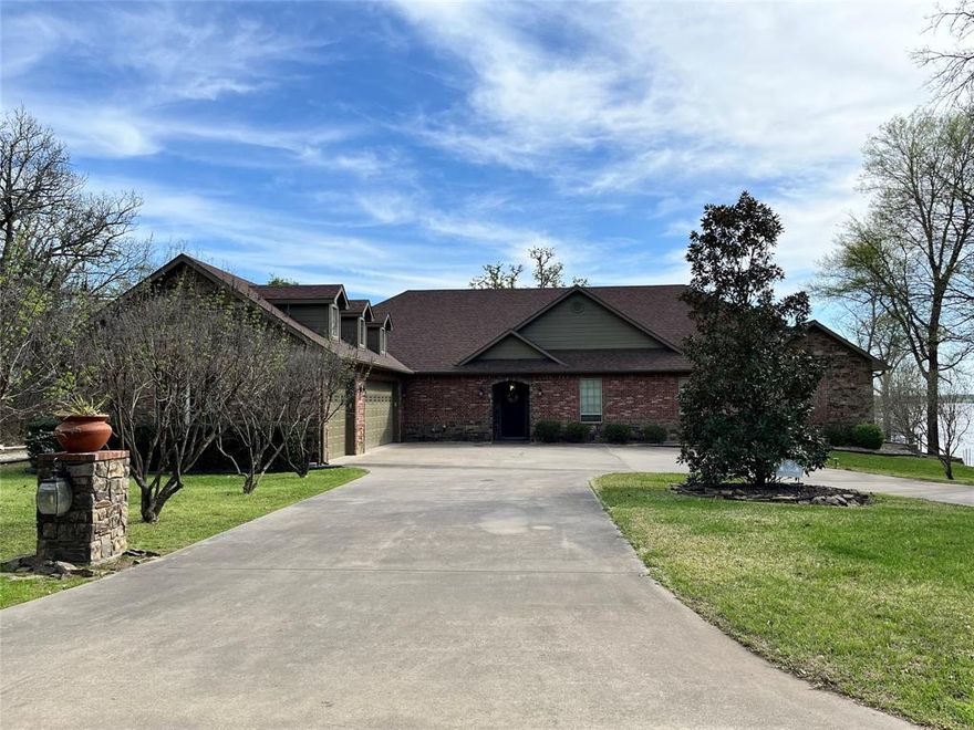 Recently remodeled, come see this stunning 4 bedroom 3 bath lake front home on  Lake Fork in Emory Texas on .72 acres + lease back. As you walk into this property you automatically feel the open and family friendly lay out. The home has been decorated by a team of professionals who spared no expense to bring this lake house back to life.  From new automized window blinds  in the master bedroom, to  the heated towel rack, and the new custom claw foot tub in the master bathroom, and  the screened in back porch with fireplace and Television right off the master suite over looking one of the premiere bass fishing lakes in the United States, this home checks all the boxes.  With large open living spaces and oversized windows to let the natural light in, you will be able to entertain at a superior level or just enjoy the beautiful sunsets right off the  large back porches.  The home was thought out and designed with storage never going to  being a problem, with natural custom built in's everywhere you will have spaces to organize all you possessions. The extra large master closet with an  island in the middle and separate attached walk in closet for your companion, it is set up for function and accessibility.  There is a large bonus room that is currently set up for yoga and personal exercise right off the custom gourmet kitchen.  Across from the exercise room is a spacious laundry room with an extra refrigerator and more custom built in cabinets and drawers galore. The home has a designated office with classic pocket doors right off the entrance and has more high end built in's.  From the Jack and Jill bathroom in between the two smaller guest room the home is set up perfect with lots of variations using your imagination to  fit your personal preferences.   THE HOME IS  MOVE IN READY FOR  IMMEDIATELY OCCUPANCEY.. Come and enjoy a beautiful part of Rains county and wonderful drive in where pride of ownership is in effect in every property you drive by on your way in .