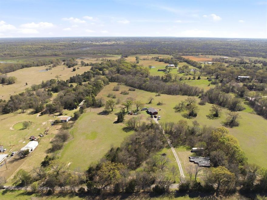Tucked away in a quiet small-town setting, this charming barndominium sits on 6.24 beautiful acres—offering the perfect blend of country living and modern comfort. Inside, you’ll find 1,800 sq ft of thoughtfully designed space featuring 3 bedrooms and 2 bathrooms, complete with stylish farmhouse finishes and durable stained concrete floors throughout.

The open-concept layout creates a warm and inviting atmosphere, ideal for both everyday living and entertaining. A standout feature is the oversized laundry room, complete with custom built-ins that provide abundant storage and organization.

Step outside and enjoy wide-open views, room to roam, and endless possibilities for animals, hobbies, or future expansion. A 16x20 workshop partially finished with a mini split for heating and cooling—perfect for tools, equipment, or weekend projects.

If you’ve been dreaming of peaceful acreage living with character and charm, this one checks all the boxes!