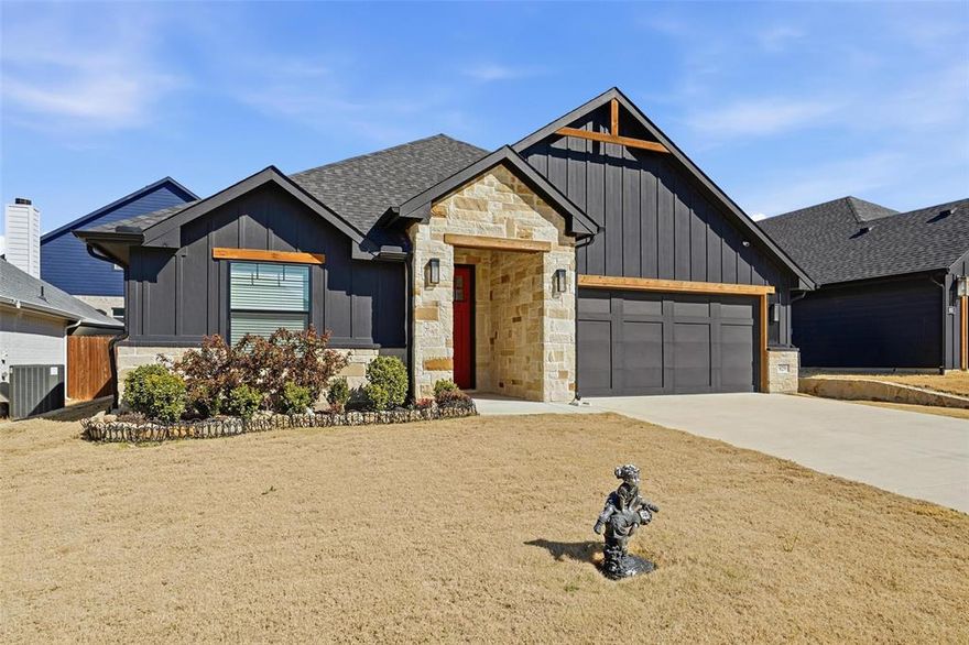 Completed in 2023, this 4-bedroom, 2-bath DoubleRock home in Hadley Farms offers a thoughtfully designed open concept layout with quality upgrades throughout. The main living area features tall ceilings, wood look tile flooring, custom lighting, stainless steel appliances, and a raised hearth fireplace, creating a comfortable space that flows easily into the kitchen and breakfast area. The kitchen combines function and style with quartz countertops, a contrasting island cabinet color, unique shaker cabinetry, stainless steel appliances, a decorative vent a hood, and generous prep and storage space. The split-bedroom design provides privacy, with the primary suite positioned away from the secondary bedrooms. The primary bath includes a large step-down shower with dual shower heads, oversized mirrors, custom finished cabinetry, and a spacious walk-in closet. The hall bathroom features a deep, oversized soaking tub. Additional features include a covered and screened in back patio overlooking the backyard, full sod and irrigation, electric HVAC, and full foam insulation for enhanced energy efficiency. A transferable 2-10 structural warranty conveys with the home. Located in Godley’s Hadley Farms community, residents enjoy a playground, splash pad, soccer field, picnic areas, and basketball court. All with NO HOA, NO MUD, and NO PID fees. Convenient access to Chisholm Trail Parkway and nearby amenities adds to the overall appeal.