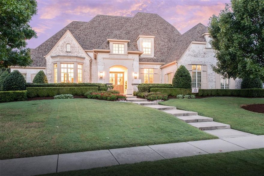 Experience timeless elegance and modern comfort at this extraordinary residence in McKinney’s prestigious Serenity community. With over 6,000 square feet of masterfully designed living space, this estate offers 6 bedrooms, 8 bathrooms, and multiple living spaces blending refined luxury with everyday functionality.

From the moment you step inside, you are greeted by soaring ceilings, designer finishes, and expansive windows that bathe the interiors in natural light and showcase the lavish backyard. The grand foyer leads to multiple sophisticated living and dining spaces, complemented by rich hardwood floors and custom millwork throughout.

The chef’s kitchen is the heart of the home, featuring professional-grade appliances, an oversized walk-in pantry, a spacious breakfast area, and seamless flow into the family room. Retreat to the grand primary suite with spa-inspired bath, dual vanities, soaking tub, oversized shower with dual shower heads, and a boutique style, custom, walk-in closet.

Designed for entertaining, the home offers a stately formal dining room with a fireplace, elegant library, music room, game room, bonus room, and dedicated theater room. Each secondary bedroom features an ensuite bath and generous closet space, creating relaxing private retreats for family and guests alike.

Step outdoors to your own resort-style escape. The backyard showcases a sparkling pool and spa with water features, covered living area, and manicured landscaping—perfect for both intimate gatherings and grand celebrations. While the pool takes center stage, the expansive backyard still boasts an abundance of green grass ideal for running, playing, or sports.

Additional highlights include a 3-car garage with epoxy flooring, multiple fireplaces, whole home water purification system for optimal wellness, and custom upgrades throughout. Ideally located within the acclaimed Lovejoy ISD, this residence offers the perfect balance of luxury and lifestyle!