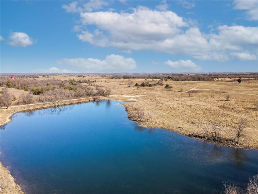 Amazing 144 acres of Income Producing Property. Build your dream home on the hill with the million-dollar view. One of highest points in the county. Ag exempt low prop taxes. Option to continue Cattle & Hay lease as well as rental of renovated 500 sf barn apt. Ride on winding trails thru fields & woods of pecan, oak, cedar & phenomenal spring fed creek ravine with rock formations. 2 ponds to enjoy fishing & boating. Plentiful wildlife includes deer, hogs, ducks for hunting or simply viewing. Remodeled farmhouse with open concept living & kitchen, oversized custom island, farm sink & granite counters. Spacious primary with barn doors to large closet and updated bathroom. 24x36 barn PLUS 48x15 equipment shop. Best deal in Wise County!