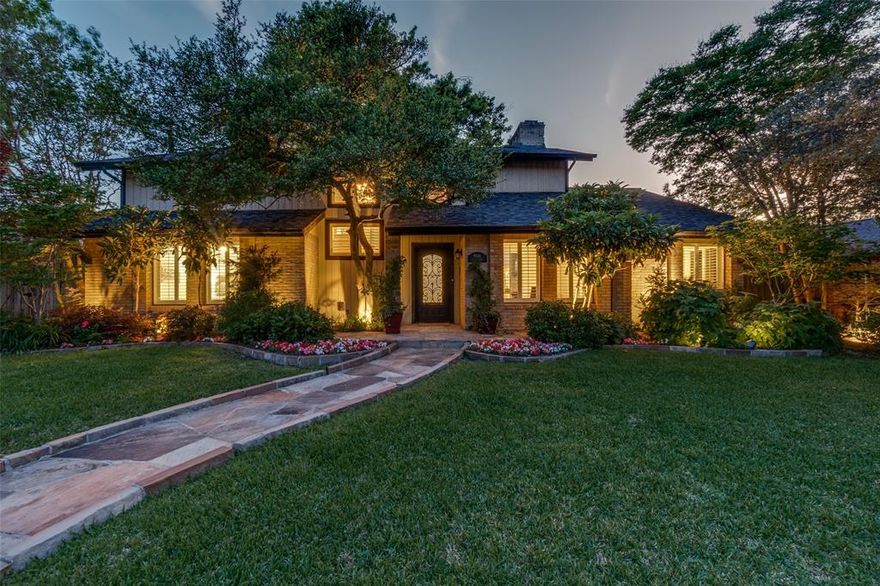 Exceptional 4-bedroom, 3-bath home in highly sought-after Lake Highlands offering outstanding indoor comfort and resort-style outdoor living. Stunning professional landscaping creates unforgettable curb appeal, enhanced by exterior dusk-to-dawn accent lighting in both the front and backyard. Flagstone detailing highlights the front entry, steps, flower beds, and an impressive backyard patio with over 1,000 square feet of flagstone entertaining space. The backyard is a true private retreat featuring a 10,000-gallon fiberglass pool with 3-foot stone elevation, water feature, and an inviting 9x10 pergola complete with ceiling fan and wood-burning fireplace. Additional exterior amenities include full front and back sprinkler systems with rain sensor and programmable controls, backyard French drain with electric sump pump for flood control, 8x10 greenhouse, 10x12 storage shed, two-car garage with electronic gate, plus third-car driveway and carport.
Inside, soaring ceilings and an ideal floor plan provide both space and flexibility. The main level features two bedrooms, all hard-surface flooring including Luxury Vinyl Plank 100% waterproof, scratch- and stain-resistant flooring, Saltillo tile in the kitchen and sunroom, fresh paint throughout, and fresh carpet upstairs. Plantation shutters add timeless style throughout the home. The kitchen is designed for both function and charm with double electric ovens, decorative glass-front cabinetry with lighting, and a large walk-in pantry. Spacious living and dining areas are complemented by a sunroom and versatile flex room perfect for a home office, playroom, or additional living space. Upstairs offers two additional bedrooms, full bath, and loft living area. Don't ever worry about not having power in this home with full home Generac Generator protection.
A rare opportunity to own a beautifully updated home with premium amenities in one of Dallas’ most desirable and centrally located neighborhoods.