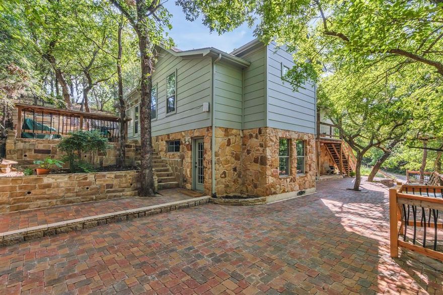 Discover this hidden treasure tucked high on a hill in the trees. Private wooded setting adjacent to Corp property with Lake Access. A sailors dream. Multi level patios with large stone fire pit and screen porch. A remote country atmosphere in the suburbs. This beautifully built custom home has all the upgrades for the discriminating buyer, granite counter tops, wood and porcelain floors, stainless steel appliances, large walk-pantry and closets. Open floor plan, kitchen overlooks huge great room with cozy fireplace and screened in porch. Stone elevation and spectacular views. Remodeled bathrooms. Large laundry room, two car garage, workshop with janitors sink and large basement storage area.