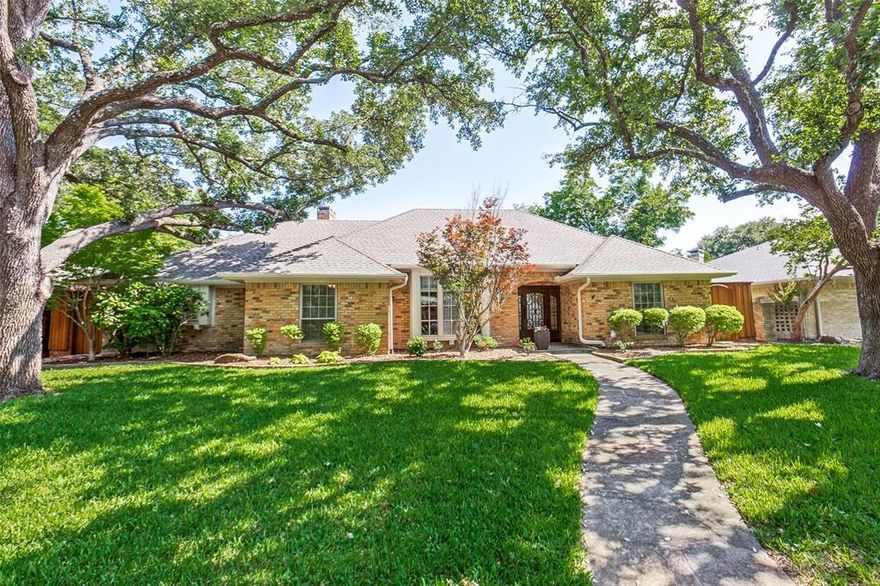 Nestled under lush live oaks, this sprawling one story exudes casual elegance. With generous room sizes and a classic floorplan that withstands the test of time, this home was brilliantly designed. The primary and two bedrooms are on one side with a fourth bedroom and full bath on the opposite side. Two separate living areas plus an office provide plenty of space for work and play. The crisp and contemporary kitchen features stainless appliances including a new Bosch dishwasher. Adjacent to the kitchen are the two spacious dining areas including a breakfast area with a built-in hutch. The large laundry room includes a mud sink and storage cabinets. The updated primary suite is spacious and features a walk-in closet with a ventilated storage system, plus an additional closet in the bedroom. An abundance of natural light shines through the large windows and skylights. Picture yourself enjoying drinks on the courtyard patio on those balmy Texas evenings. Out back, a lush green backyard surrounded by a beautiful stained BOB fence provides total privacy. Recent updates include hot water heater, AC units, extra ductwork, updated jack and jill bath, popcorn removal, carpet, landscaping and sod. Top-ranked RISD schools are nearby including Pearce High School right down the street and Bowie Elementary around the corner. Feed the ducks and sit on a bench and read your favorite book at one of the two lakes in the neighborhood within walking distance. Highlands North is truly one of the most beautiful and coveted neighborhoods in Far North Dallas. Only 14 miles to downtown Dallas, this home is truly the perfect package!