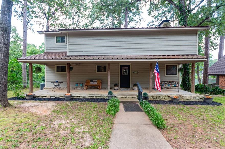 Step into timeless character and lakeside charm with this unique 3 bedroom, 2 bathroom, 2 story home offering 2,440 square feet of living space. From the moment you enter, you’re greeted by rich wood panel walls, a stunning stone fireplace, and a dramatic spiral staircase that leads to a spacious second floor. The large, carpeted living room is perfect for relaxing or entertaining, while the kitchen and dining area are bright and inviting, featuring classic saloon style doors that add a touch of vintage flair. Upstairs, an open loft-style area overlooks the main living space below and offers endless possibilities for a game room, office, or additional living space. Enjoy year-round relaxation in the enclosed sunroom with a private hot tub, or head outside to the expansive deck that leads directly to the lake. Whether you're hosting guests or just soaking in the view, the covered boat slip and large deck make lake days easy and enjoyable. With a large carport garage and extended driveway area, there’s plenty of room for parking, guests, and toys. This one-of-a-kind home combines rustic charm, space, and serene waterfront living, don’t miss your chance to make it yours!