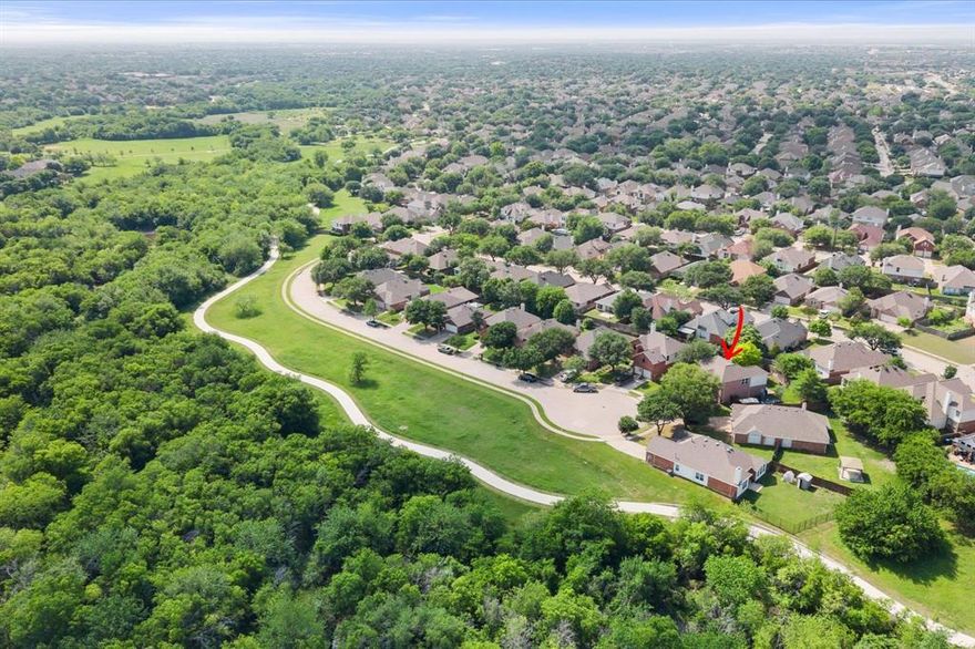 Imagine waking up across from 217 acres of trails and wide-open Texas sky — then walking to Starbucks before breakfast. That's everyday life at this Park Glen gem, tucked quietly at the end of a cul-de-sac directly across from ARCADIA TRAIL PARK. 12+ miles of walking paths with 18-hole disc golf course, playgrounds, sports courts… PLUS Walmart, Walgreens, Shipley's Donuts, and a dozen-plus restaurants and shops are all within walking distance. *** Here's where it gets really good. The sellers bought this home planning to stay forever — paying $40,000 MORE than this current asking price, then pouring another $70,000+ into thoughtful updates: luxury vinyl plank flooring, fresh paint, lighting, energy-efficient windows, refreshed bathrooms and an extended, updated kitchen with butcher block counters and herringbone backsplash. An out-of-state relocation changed everything. So in this buyer's market, ALL THAT EXTRA VALUE IS YOURS. *** Grand entry with soaring ceilings and archways opens to 2,428 sq ft spanning 4 bedrooms and 2.5 baths. The primary suite is on the main floor, and every other bedroom is split, tucked away in its own corner. Two living areas: an open-concept main space anchored by a stunning fireplace, plus an upstairs bonus room. A flex front room works as formal dining, office, sitting room, or playroom. Out back, a tall retaining wall creates the feeling of a private fortress — a SECLUDED RETREAT wrapped in mature shade trees. *** Park Glen took home several Fort Worth MAYOR'S NEIGHBORHOOD AWARDS recently — making this one of the most engaged, safe, and family-friendly neighborhoods in Fort Worth. You're also zoned to top-rated KELLER ISD — Fossil Ridge High is walkable via the trail, and the bus stop for Bluebonnet Elementary and Fossil Hill Middle is at the end of the street. *** Explore the HOME SHOWCASE MAGAZINE online with a 16-PAGE SPREAD (MLS # 21246602), and be sure to take the 3D Tour. At this price, in this neighborhood, it won't last long!