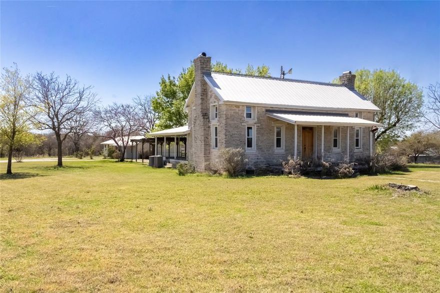 Sitting on a 21.5-acre tract, this historic 1870 stone home offers a rare combination of character, versatility, and expanded acreage just minutes from Stephenville along Hwy 67. For added flexibility, the property is also available as a 10-acre or 21.5-acre offering, allowing buyers to choose the layout that best fits their needs.

The residence has been thoughtfully maintained, preserving its original charm while incorporating updates for comfortable everyday living. Inside, you’ll find 3 bedrooms and 3 full bathrooms, along with a basement space that provides additional storage or functional use. Timeless details such as hardwood floors, solid stone construction, and welcoming covered porches highlight the home’s enduring Texas appeal.

A separate guest apartment adds even more versatility, featuring its own bedroom, bathroom, living area, and kitchen—ideal for extended family, visitors, or potential rental income.

The 21.5 acres provide ample room for a variety of uses, complete with improved grasses, perimeter fencing, and a gated entrance. The property is well-equipped with a horse barn, multiple equipment sheds and carports, and a traditional windmill paired with a stone water trough—blending practicality with rustic charm.

This is a unique opportunity to own a piece of history with enough land to truly enjoy country living, while still having the option of a smaller acreage configuration. Properties offering this level of character, flexibility, and location rarely come available.