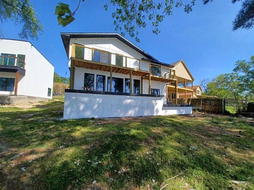 Beautiful modern traditional waterfront home located in a well-established Mabank community, offering peaceful lake living with convenient access to shopping, dining, and recreation. This spacious 4-bedroom, 4-bath residence features an open layout with quality finishes, a fireplace, and energy-efficient upgrades throughout. Enjoy outdoor living with a covered porch, patio, and balcony—perfect for taking in the water views. The home sits on an irregular waterfront lot and includes ample driveway space along with functional design for both everyday living and entertaining. Move-in ready and in overall good condition, this property presents an excellent opportunity for luxury lakefront ownership.