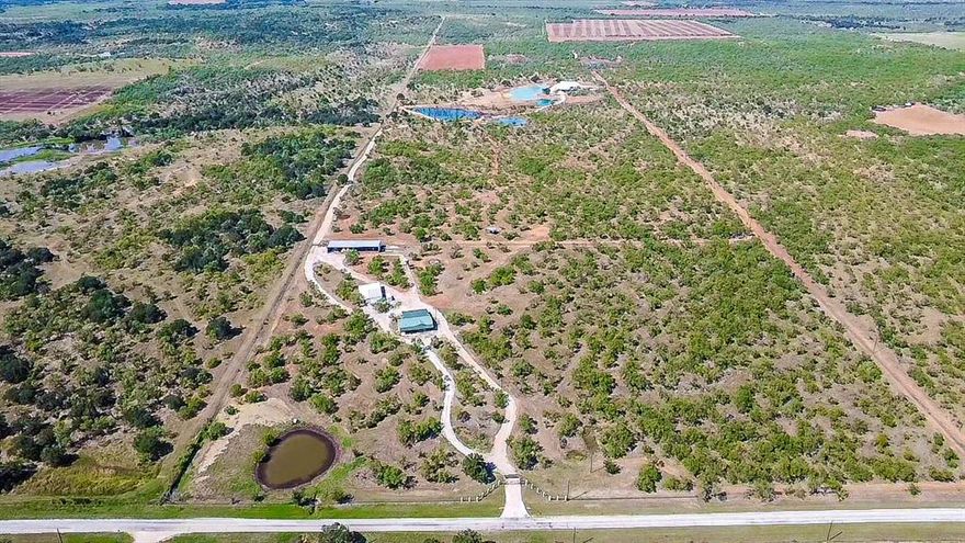 Creed Ranch spans approximately 500 acres of varied North Texas terrain, offering extensive recreational, residential, and agricultural potential. The property is anchored by a 6,920 sq. ft. custom barndominium featuring 5 bedrooms, 3.5 baths, lodge-style living areas, modern finishes, and expansive window lines designed to showcase the land’s natural landscape.

A separate 3-bedroom, 2-bath barndominium bunkhouse provides additional accommodations suitable for guest groups, extended family, or hunting parties, creating flexible options for hosting and retreat use.

The ranch includes stocked water features (per seller), open native pasture, established trails, elevated insulated stands, hunting blinds, and an on-site game-processing facility. These improvements support year-round outdoor activities, recreational use, and broader land-management operations.

The owner reports a diverse mix of native and exotic wildlife, including Texas Longhorns, Ankole-Watusi, Blackbuck, Fallow, Axis, Oryx, Aoudad, Whitetail, and signature animals such as “Tomahawk” the American Bison and “Rocky” the Longhorn. Wildlife presence varies with seasons and natural conditions.

The Seller holds 100% of the surface estate and 321.71 acres of mineral rights. Mineral rights are not included but may be negotiated separately.

With multiple residences, established infrastructure, varied habitat, and a broad wildlife mix, Creed Ranch represents an uncommon opportunity to acquire a large-format recreational property with extensive versatility and long-term land potential.