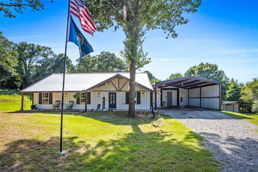 Nearly new barndominium on stunning 2 acres on a hard-surface road just outside Bells,Texas! Beautiful mature trees on the property. Backyard goes back into the trees for boundless opportunities for a firepit, recreation, outbuildings, anything you can think of. Country living without city restrictions. Relax on the peaceful front porch! Vaulted ceilings add to the spacious feel of the open-floor plan with lots of natural light. Kitchen island, energy-efficient appliances. Gas log fireplace. New covered back patio, 2-car carport, and a well-built shop for outside office or side business, all sitting on a new solid concrete slab.