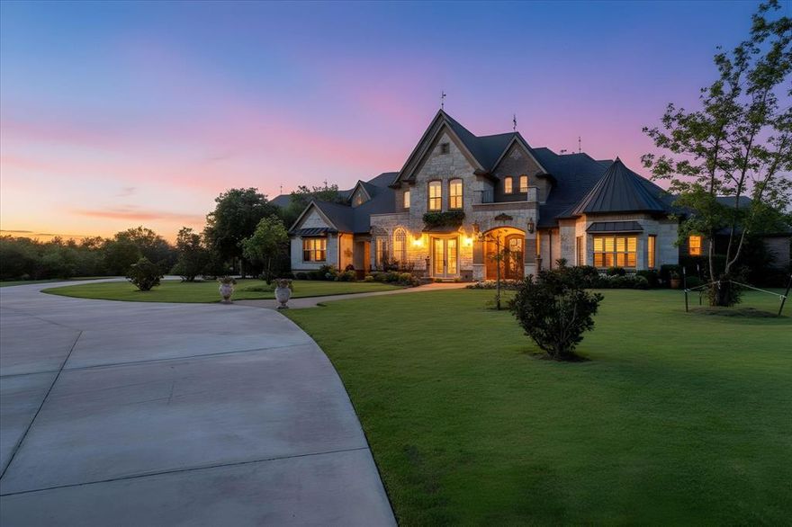 This breathtaking modern French farmhouse estate spans nearly 8,000 square feet and rests on just under 20 acres, with additional acreage available for purchase. Completely remodeled with custom finishes, this home combines timeless elegance, modern functionality, and every amenity for refined country living. Inside, you’ll find handcrafted knotty alder cabinetry, Level 5 leathered granite, custom architectural shingles, and commercial-grade appliances. The home offers newer HVAC units, a hot water heater, and abundant storage throughout. The layout includes a lavish master suite with a private nook, multiple his-and-hers closets, and a spa-like bath with dual entrances into the oversized shower, plus a mother-in-law suite for extended family or guests. A grand office provides the perfect setting for work or study. Additional highlights include an oversized garage, state-of-the-art golf simulator with access to world-class courses, and thoughtful design touches at every turn. The property welcomes you through a gated entrance framed by majestic live oak trees and a circle drive, setting the tone for the estate’s elegance. Outdoors, enjoy rolling pastures, fruit trees, a thriving garden, And a Custom Chicken coop and Greenhouse. A large storage facility provides room for an RV, boat, or recreational toys. The well water system handles all irrigation while city water is available for the home. The land carries an Ag Exemption for significantly reduced property taxes. Your backyard oasis includes a sparkling pool, basketball court, and multiple spaces for entertaining, making it ideal for both relaxation and gathering. Just minutes from I-35 This property is easily accessible to anywhere in DFW. Additional 43.93 of acreage can be purchased. See MLS# 21056251. Contact Listing agent for further details and additional photos.