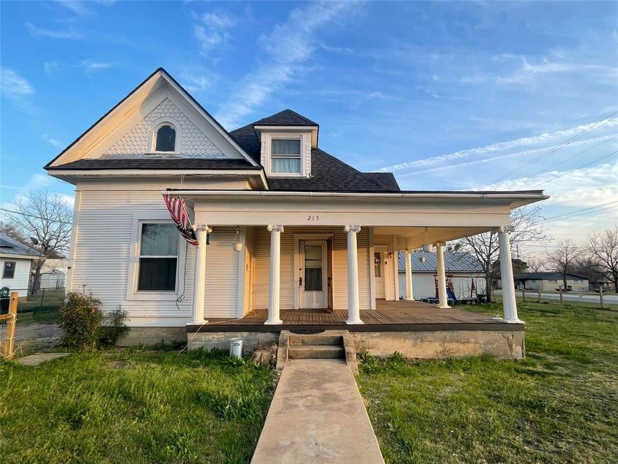 Own a piece of Hill Country history! This 1,590 sq ft, 3-bed, 2-bath traditional home sits on a fenced 0.25-acre corner lot. Enjoy stunning sunsets from the iconic wraparound porch. Major updates have been done, including brand-new roof, fresh upstairs carpet, and gas fixtures. All appliances convey! The property also offers a massive, detached cinderblock workshop-garage with a roll-up door—perfect for hobbies or storage. A premier investment or dream home waiting for your final touch. Small-town charm at its best!