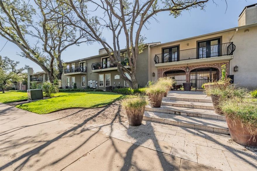 Charming 2-Bed, 2-Bath Ground-Floor Condo just steps away from pool access! This open floorplan unit features hardwood floors, granite countertops, stainless steel appliances, and a dual-sided gas fireplace. Large windows bring in natural light and overlook the landscaped grounds. A private patio provides outdoor living space. The gated community offers a resort-style pool and spa, outdoor grilling areas, a fire pit, and mature palm trees. Two assigned covered parking spaces are included and conveniently located right outside the back patio access. The property is in the heart of central Dallas, close to shopping, dining, and entertainment.