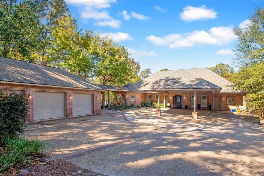 Welcome to this exquisite 5-bedroom, 5-bathroom waterfront home on the stunning shores of Lake Palestine. With three stories of thoughtfully designed living space, a 3-car garage, RV carport, private elevator, and full wheelchair accessibility, this property perfectly blends luxury, comfort, and functionality—making it the ultimate lakeside retreat.

Step inside to breathtaking water views and abundant natural light pouring through the home’s 6x3 glass windows and six elegant French doors. The spacious living room centers around a beautifully crafted fireplace, creating a warm and inviting focal point while showcasing the lake beyond.

The kitchen is a chef’s dream, featuring elegant countertops, generous storage, induction cooktops, a built-in ice maker, and a wine cooler in the large island—perfect for entertaining. The pantry, complete with library-style ladders, adds both practicality and charm. Every fixture throughout the home has been carefully chosen, blending craftsmanship with timeless luxury.

With a designated office, flex space, and craft room with exceptional storage, you’ll have endless versatility for work or hobbies. The grand master suite offers a serene escape with direct access to the 10x70 balcony overlooking the water. The master bathroom features dual vanities, custom cabinetry, and a bright, spa-like design.

Downstairs, the basement provides limitless potential—ideal for a game room, gym, media area, or guest quarters. Each bedroom and bathroom is spacious and filled with natural light for comfort and flexibility.

Outside, the 10x70 covered patio below the balcony offers another beautiful space to relax while taking in the lake’s tranquil beauty. The large backyard provides endless possibilities—whether you dream of adding a pool, outdoor kitchen, or simply enjoying open space.

This property includes access to a leased shoreline complete with a private boathouse and pier, giving you direct water access.