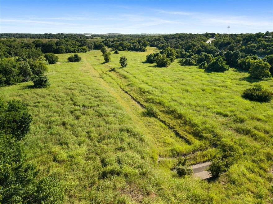 This is a rare opportunity to acquire approximately 39 acres of prime land in the heart of Willow Park, one of the most desirable and fastest-growing communities in Parker County. Zoned R-1 for single-family residential use, this expansive property is perfectly suited for a custom home development, boutique subdivision, or long-term investment in a thriving North Texas market.  City water is already available at the street, and city sewer is located nearby, offering strong potential for efficient utility access and infrastructure planning. The property's gently varied terrain provides both natural beauty and a flexible layout, allowing for creative site design that takes full advantage of the land’s topography and scenic features. Ideally situated just minutes from I-20, this location offers quick and easy access to Aledo, Weatherford, and the greater Fort Worth area. Future residents will enjoy proximity to top-rated schools, parks, retail centers, and other key amenities, making this an attractive and convenient place to call home. As Willow Park continues to experience strong residential growth and rising property values, developable tracts of this size and quality are becoming increasingly rare. With favorable zoning, public utilities nearby, and excellent access to surrounding areas, this property presents a compelling opportunity for developers, builders, or investors looking to capitalize on the region’s continued expansion.