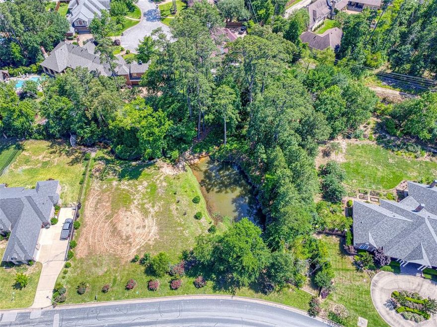 2198 Pinehurst St is a rare vacant lot in the highly sought-after Hollytree subdivision that offers a unique opportunity to create a private retreat in the heart of South Tyler. This homesite features private, tranquil views of your own forested backyard, a serene bass pond, and untouched natural beauty, all just steps from premier golf, tennis, and dining amenities.Whether you're looking to design a luxury estate or a peaceful getaway, this lot provides an unparalleled setting with the perfect blend of exclusivity and nature. Enjoy morning coffee overlooking the water, evening walks beneath a canopy of trees, and daily access to the elite Hollytree Country Club lifestyle. Lots like this don’t come around often; secure your slice of East Texas paradise today!!