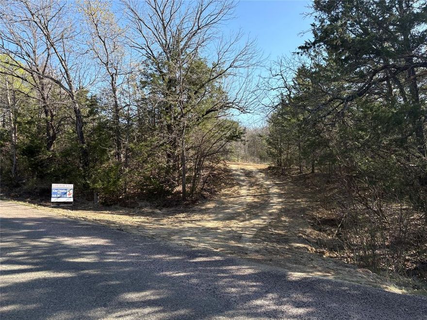This beautiful 1.983 acre lot is located just minutes from Lake Texoma offering boating, fishing, hiking and hunting. Cedar Mills Marina is just minutes away. Strategically cleared for privacy, the lot offers several beautiful building sites and a driveway!  The brush piles will be burned and removed. The exciting influx of development at Lake Texoma makes this an ideal time to invest, just close enough to the fun but still in a quiet, secluded area. Major upcoming developments to the Lake Texoma area are Hard Rock Hotel, Margaritaville Resort, casinos, prime retail, dining, amenities and much more!