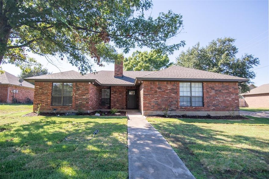 Welcome home to this newly renovated 3 bed, 2 bath brick home in a charming, established neighborhood facing Whitesboro's Godwin Park! Enjoy the peaceful view of the park as you sit on your front porch, or step out and enjoy the walking path, playground, pool, and other amenities the park offers. Inside the home, you will find an inviting open floor plan, vaulted ceilings in the living and master, a wood burning fireplace, a built-in china cabinet, and space for seating at the kitchen peninsula. The primary bedroom features a large closet and en suite with a walk-in shower.

Updates completed in 2025 include fresh paint throughout the interior and on the exterior trim, quartz countertops in the kitchen and bathrooms, tiled showers, new dishwasher and range, luxury vinyl plank flooring installed throughout, new roof, and foundation leveled with lifetime transferrable warranty, to name a few. Don't miss this rare opportunity to own a home in this location - schedule your showing today and make this house your forever home!