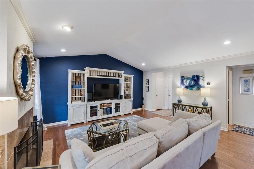 Completely Updated 2-Bed 2-Bath Condo in Prime North Dallas Location. Perfectly located in a gated community near Royal Lane and Hwy 75. This two-bedroom, two full bath residence blends comfort, style, and convenience in one complete package. Bright, open living area with vaulted ceilings and cozy wood-burning fireplace. Wood floors and solid surfaces throughout the entire unit. Remodeled kitchen showcases quartz countertops, tile backsplash, new stainless appliances, and a moveable island—perfect for everyday living or entertaining. Separate dining area and abundant natural light add to the home’s spacious feel. Both bedrooms are generously sized with excellent closet space and large windows. The bathrooms have been thoughtfully remodeled with designer finishes that will impress the most discerning buyers. Enjoy outdoor living on the rare covered rear balcony with private staircase access to your assigned covered parking space. The unit offers front and rear entries for added convenience. Private mailbox inside the building means never having to visit a community mailbox in the rain. Brand New Chillers installed for the whole complex in 2025 means ice cold AC for the summer months! HOA takes care of your electricity, water, sewer, trash, exterior insurance, and maintenance, as well as upkeep of the grounds and community pool. Located just minutes from top dining, entertainment, and major highways, this condo offers an easy lock-and-leave lifestyle in the heart of Dallas. This place is incredible, and photos don't do it justice. Schedule a tour today!