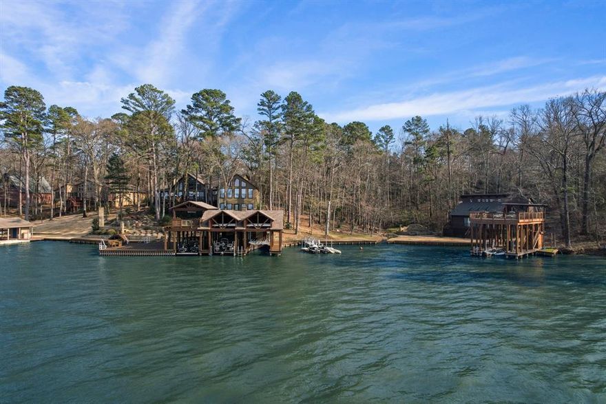 Luxury lake living on Lake Cypress Springs! Sitting on 4.5 acres are two waterfront homes with an additional living facility, oversized garage, gymnasium across the street. Guests will not be a problem at this property as the main home features 6 bedrooms, a loft, and a game room with built in bunks. The Ipae boat house features 3 lifts, spacious separate level sundecks, and an outdoor stone fireplace with a seating area overlooking the lake! The guest house includes 2 bedrooms, upstairs sleeping loft, and 2 full bathrooms. Included is a separate Ipae boathouse with lift and upstairs sundeck. Across the street there is a 4 bay garage with storage, 2500 sq ft of living, and a regulated size air conditioned gymnasium. This property also includes a 31+- acre recreational tract with a 5 acre stocked pond, shooting range, and more within 2 miles of the residential properties! This is the perfect property to spend days with friends and family, to make memories that will last a lifetime.