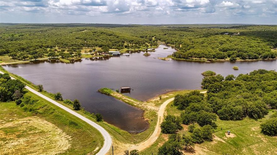 Welcome to your ultimate outdoor getaway, an exceptional 82 acre ranch perfectly positioned next to Amon G. Carter Lake in Bowie, Texas. This turnkey recreational paradise is ideal for the sportsman, nature lover, or family seeking a peaceful escape with all the amenities.

At the heart of the property lies a stunning 20 acre stocked lake, teeming with trophy largemouth bass and giant catfish, a true angler’s dream. For waterfowl enthusiasts, the established duck blind provides excellent duck hunting opportunities throughout the season.

The ranch is anchored by a 2,640 sqft lodge offering all the comforts of home including a full kitchen, bathroom, spacious sleeping quarters, and breathtaking views of the water. Whether you're enjoying morning coffee or watching the sun set over the lake, this lodge is designed for both relaxation and entertaining.

Additional features include a private dock, equipment fishing house, and gently rolling terrain with mature trees. Wildlife is abundant with whitetail deer and turkey throughout the property, making it a true year-round hunting destination.

Located just 1.5 hours from the DFW Metroplex, this property combines convenience with seclusion making it an ideal weekend retreat, family compound, or legacy ranch.