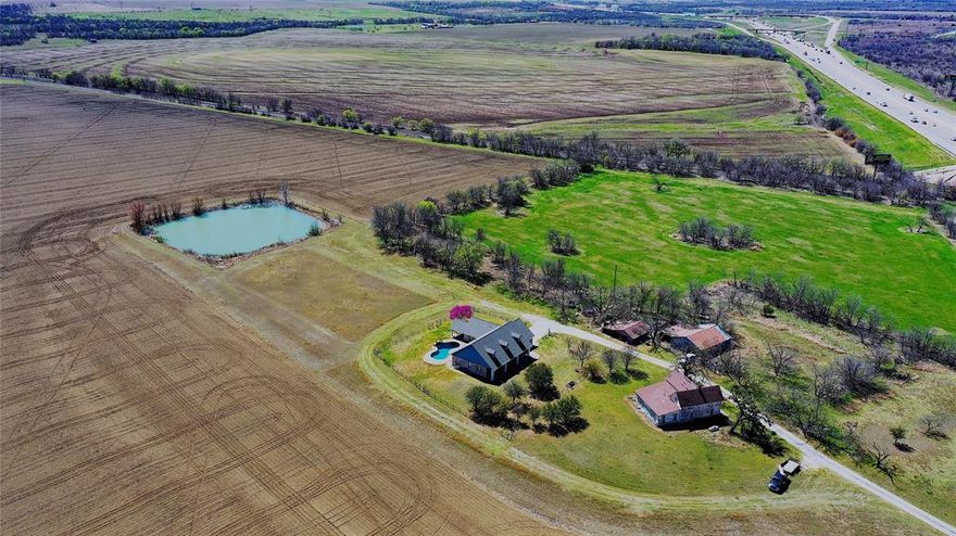 Available for sale for the first time since the 1940s, this 200+ acre farm has all you need for current and potential income. Located on the northbound side of I-35 South of Hillsboro, this property has more than 700 feet of road frontage, 3000+ feet of Union Pacific railroad frontage, and is located in the Hillsboro extra-territorial jurisdiction (ETJ).

The home is a 3 bedroom, 2 bathroom, 2 car garage split floor plan setup with high ceilings and a luxurious pool. Relax and enjoy the sunset’s peaceful reflection in the clouds or get up early for the sunrise. The 190 acres in cultivation provide you with passive income from the tenant farmer or a blank canvas to implement your vision. 

There are two ponds on the property, one measuring 0.6 acres in size and another measuring almost 2 acres in size. The first pond is stocked with catfish and bluegill perch and the larger pond is stocked with catfish and bass. In addition to the ponds, there are wooded nature areas at the back of the property.

With this property, you’ll be conveniently located 30 minutes from Waco, an hour from Fort Worth or Dallas, and two hours from Austin. You’re also close to two lakes - Lake Aquilla and Lake Whitney - for fishing, boating, camping, RVing, and so much more. Imagine the possibilities and contact us for more information.