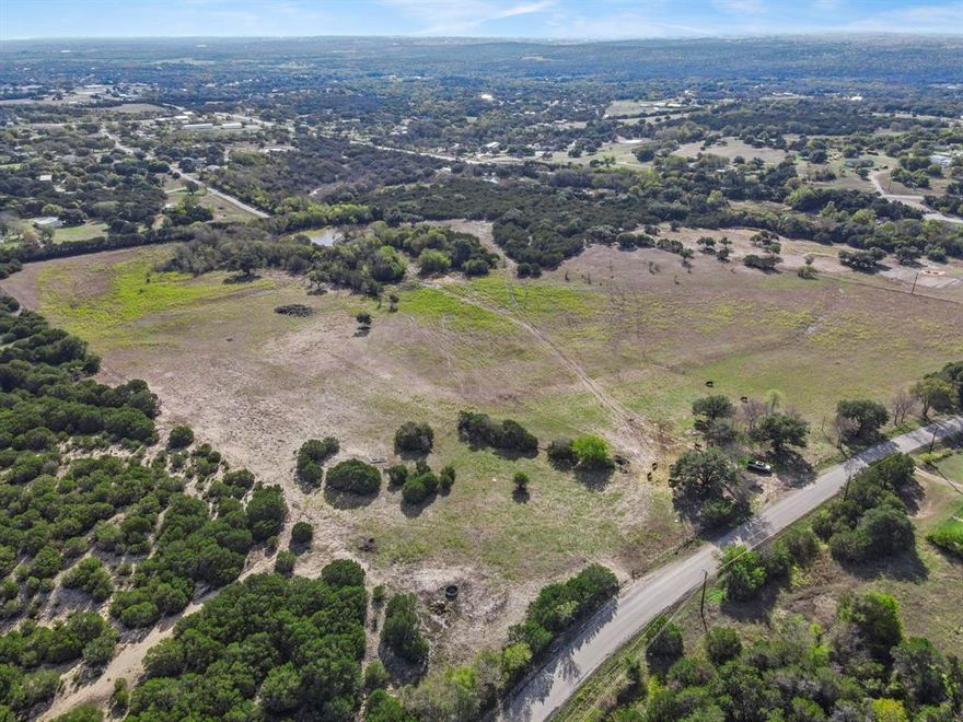 Located just minutes from Dove Ridge Winery and within Azle ISD, this 14-acre ag-exempt property off Tucker Drive offers both natural beauty and privacy. Featuring a spring-fed tank and a unique Indian tree, this land is ideal for nature lovers, horse enthusiasts, or anyone seeking a tranquil retreat.

A gated cul-de-sac will be constructed, accommodating only three homes that will share a common entrance, ensuring a private and exclusive community. The land has been recently replatted and is ready for your custom dream home.

Seller Conditions: To maintain a high standard of construction and protect property values, the seller reserves the right to build the residence on the purchased property. Additionally, the seller is offering a 10% discount off the listing price with a build job contract for the new owner.

This is a rare opportunity to own a pristine piece of Texas countryside, complete with natural features and close proximity to Fort Worth. Don’t miss out!