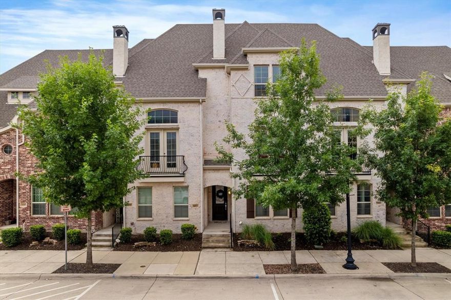 Experience luxury living in the heart of one of North Texas’ fastest growing cities. This stunning north facing townhome is ideally located in Downtown Frisco, just minutes from major destinations like PGA Frisco, the upcoming Universal Kids Resort, Frisco Square, Toyota Stadium, and endless dining, shopping, and entertainment. This move-in-ready residence features a modern transitional design with a highly functional layout. The first floor offers a spacious game room, private bedroom, full bath, and utility room, making it perfect for guests or flexible living. The chef’s kitchen is a showstopper with Quartz countertops, stainless steel appliances, gas range, built in microwave, under-cabinet lighting, a breakfast bar, and an oversized walk in pantry ideal for entertaining and everyday living. The primary suite feels like a private retreat with a spa inspired bathroom showcasing a deep freestanding soaking tub, frameless glass shower, dual vanities, and a custom walk in closet. Additional highlights include a sleek electric fireplace, balcony with French doors, two laundry rooms, 8 foot solid wood doors, and high end finishes throughout. All of this is just steps from Frisco Square and offers easy access to the Dallas North Tollway, making commuting a breeze while enjoying everything Frisco’s rapid growth and development has to offer.